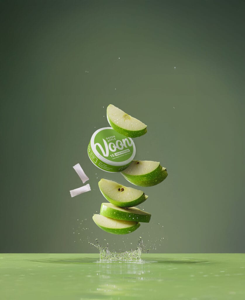 Sliced green apple with floating container with Voon Green Apple